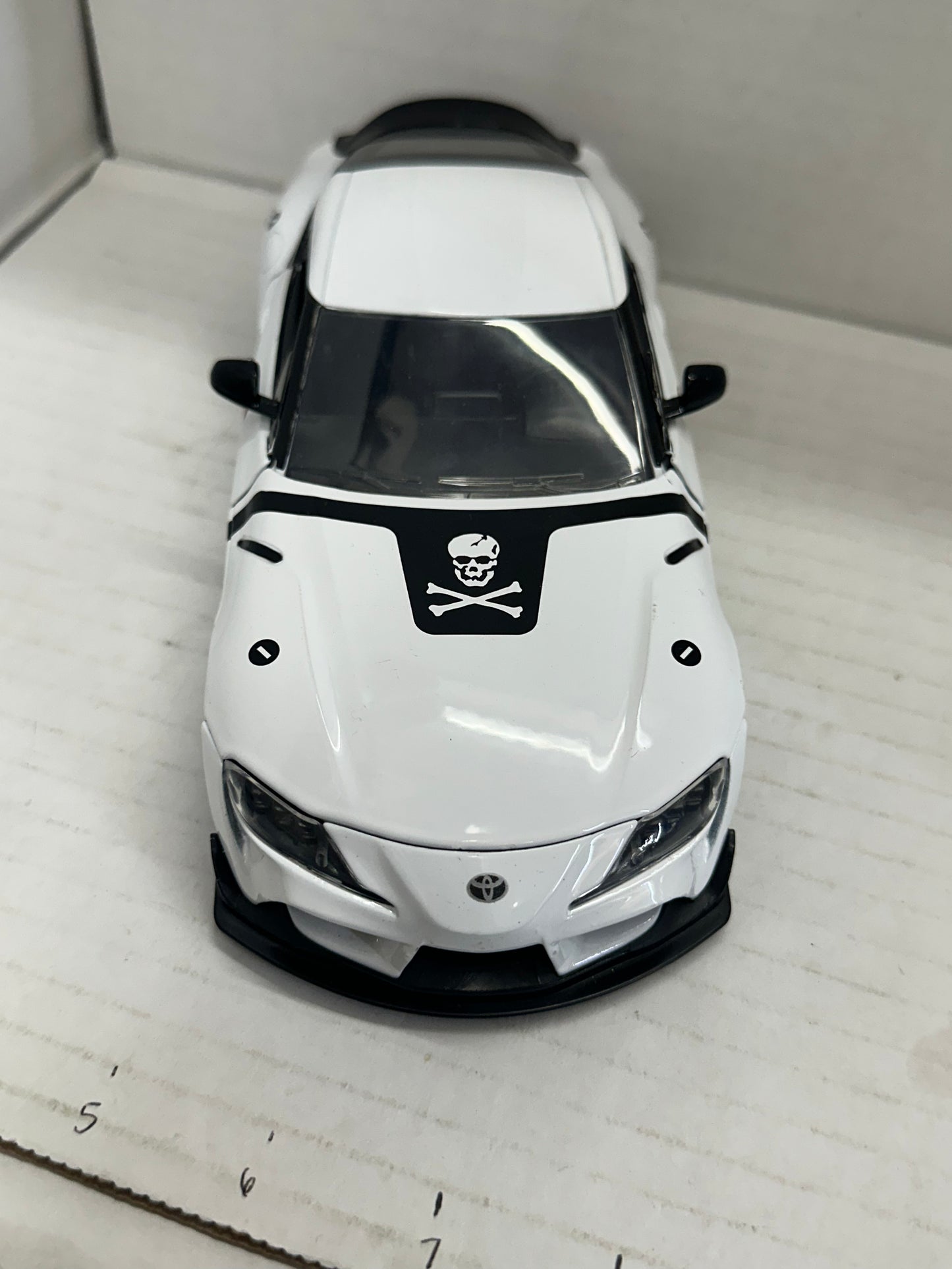 JADA 1:24 2020 TOYOTA SUPRA SKULL-1  ROBOTECH DIE-CAST WHITE 33682