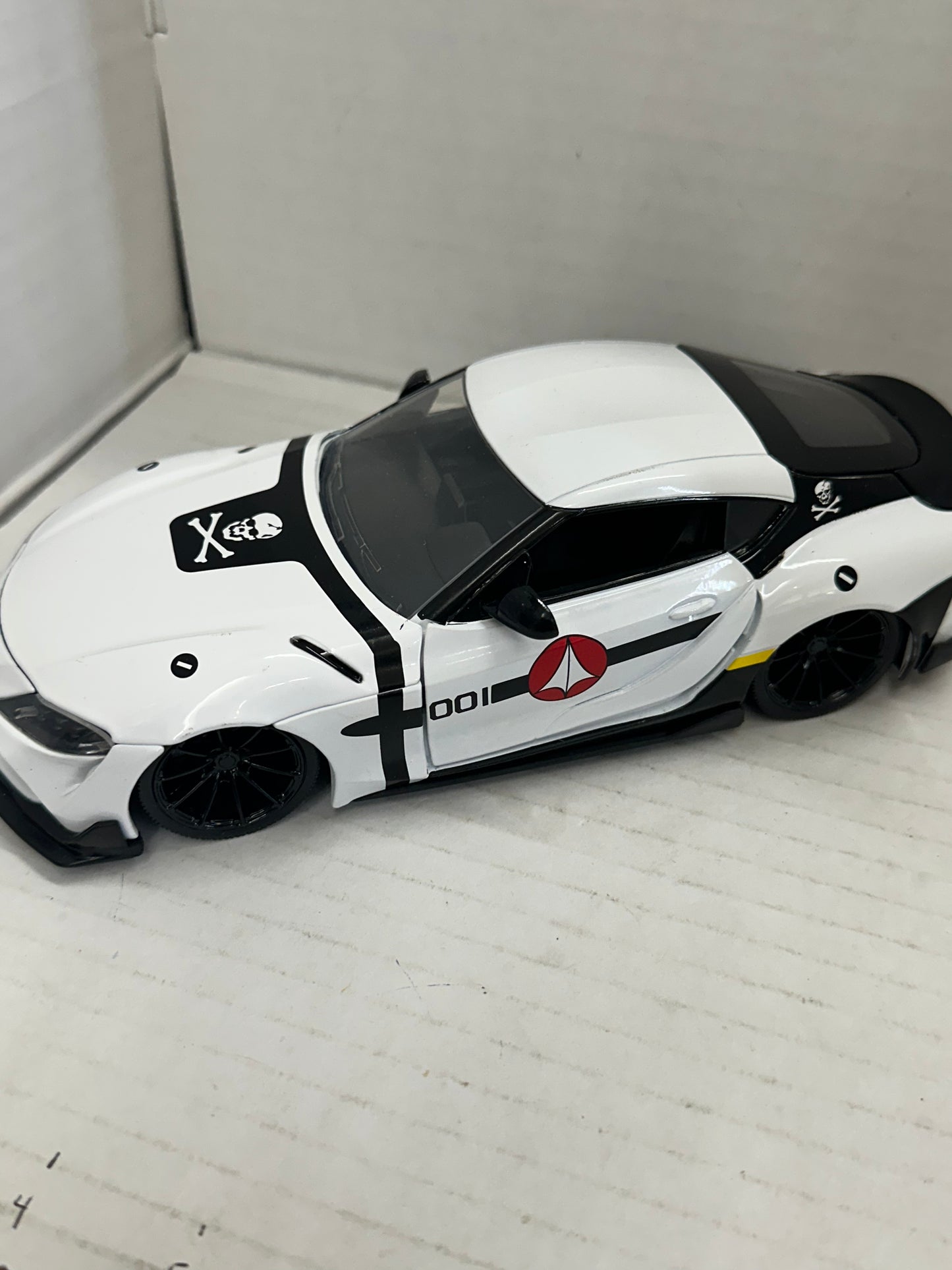 JADA 1:24 2020 TOYOTA SUPRA SKULL-1  ROBOTECH DIE-CAST WHITE 33682