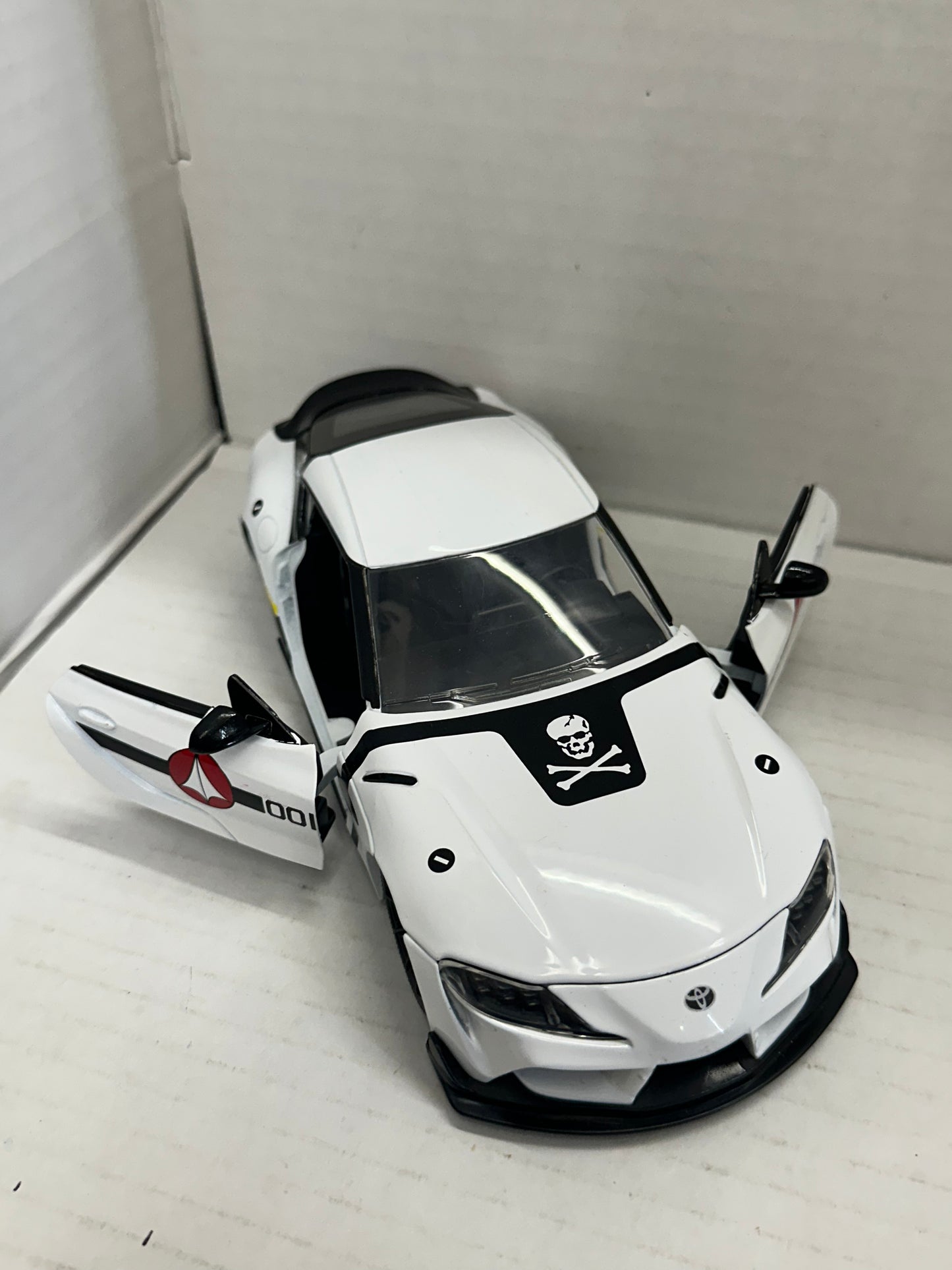 JADA 1:24 2020 TOYOTA SUPRA SKULL-1  ROBOTECH DIE-CAST WHITE 33682