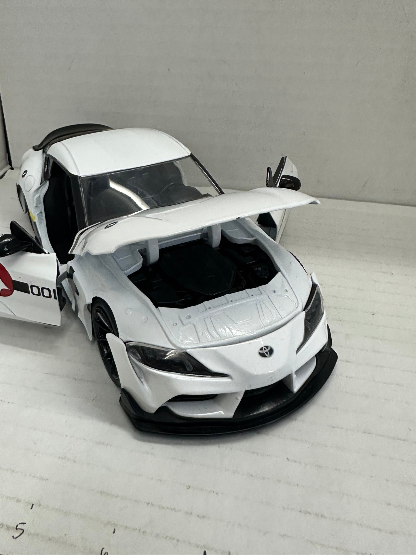 JADA 1:24 2020 TOYOTA SUPRA SKULL-1  ROBOTECH DIE-CAST WHITE 33682